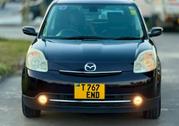 Mazda Verisa 2009 Maroon for sale