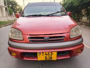 Toyota Raum 2002 Red for sale