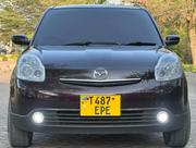 Mazda Verisa 2010 Maroon for sale